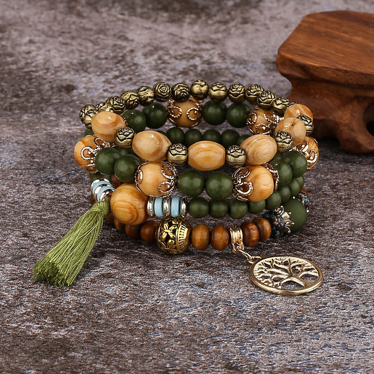 Bohemian Charm: Set of 4 Wooden Bracelets with Tree and Pompon Pendant